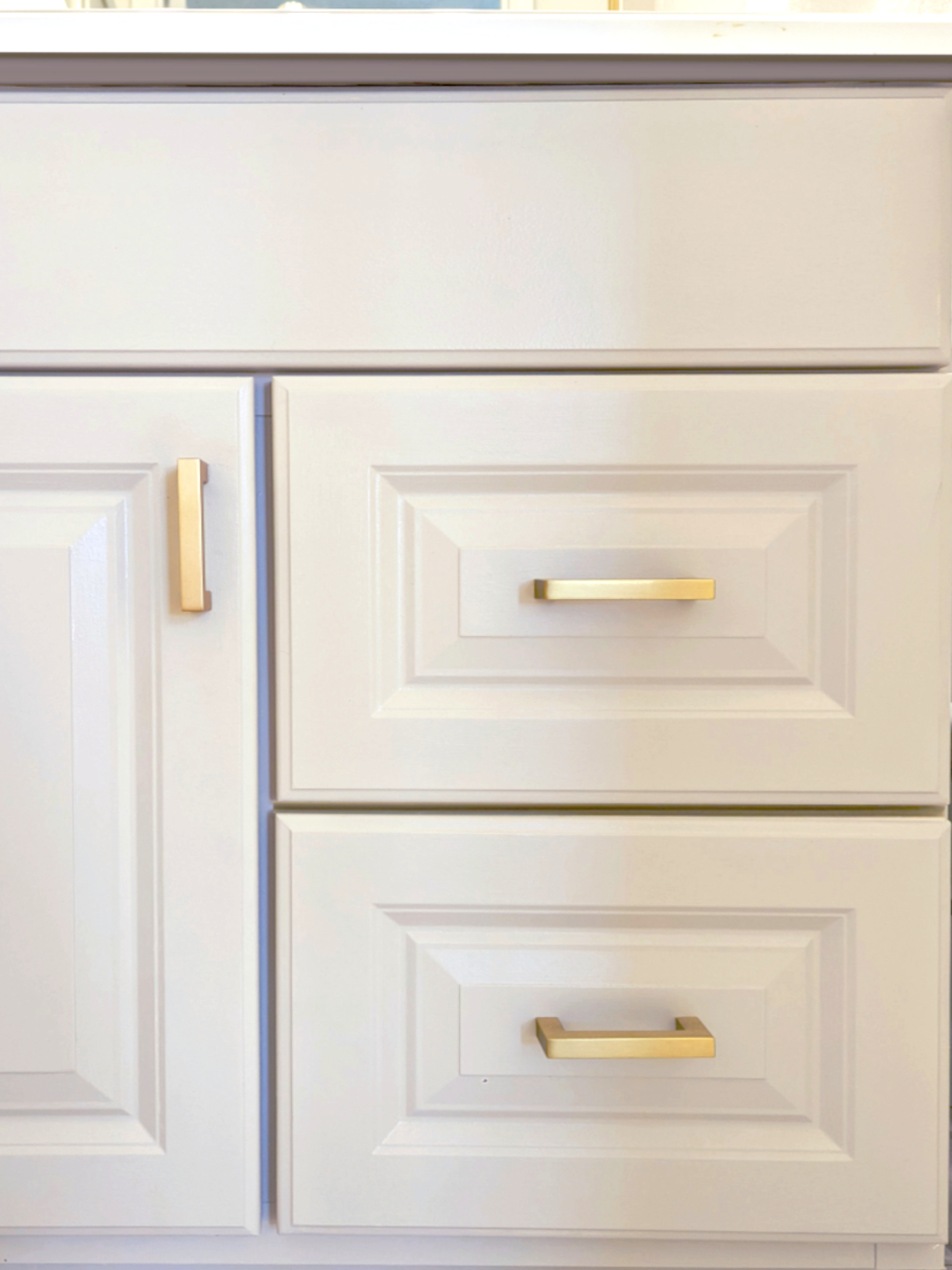 Cabinet Detail with creamy beige cabinet and gold hardware